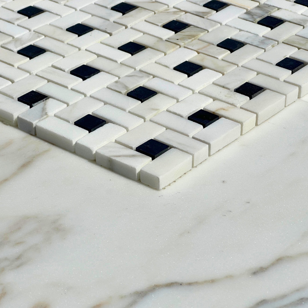 Calacatta Gold Marble Pinwheel with Black Mosaic