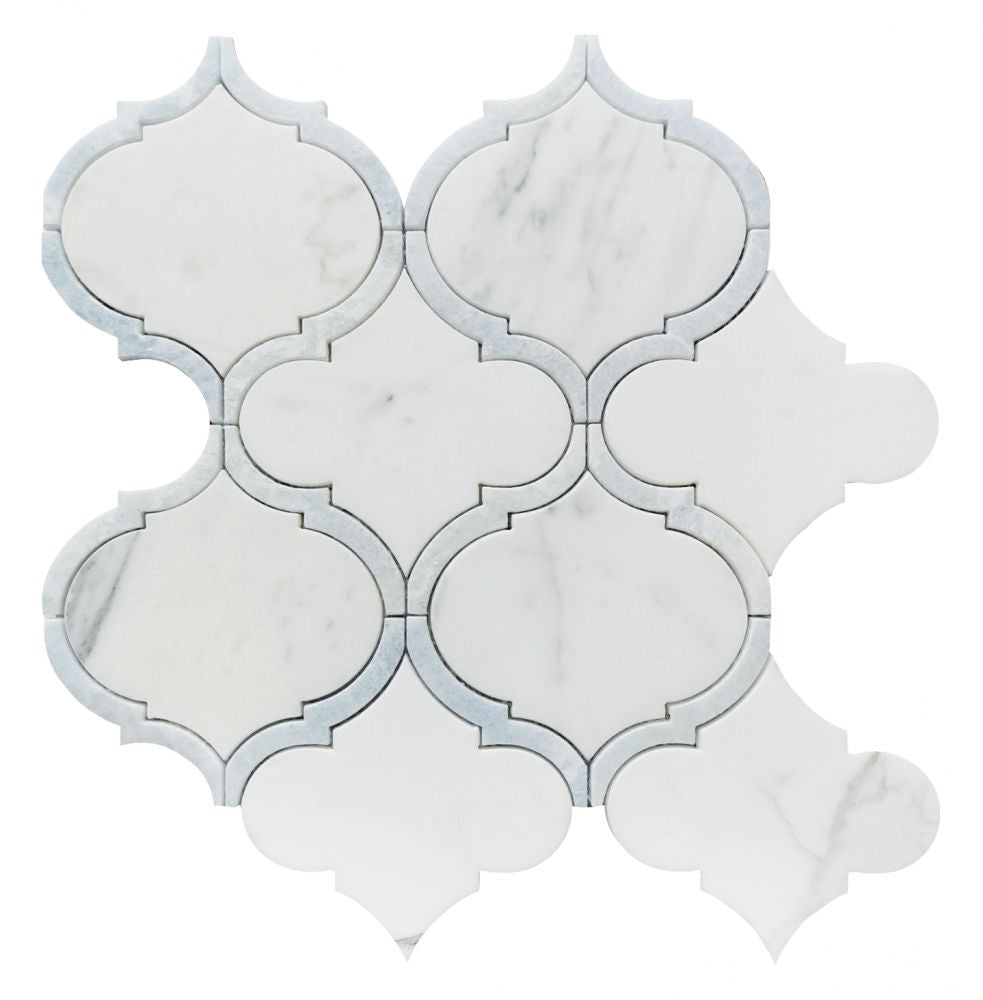 Alice Precious Blue tile with white marble and blue accents in an ornate pattern.