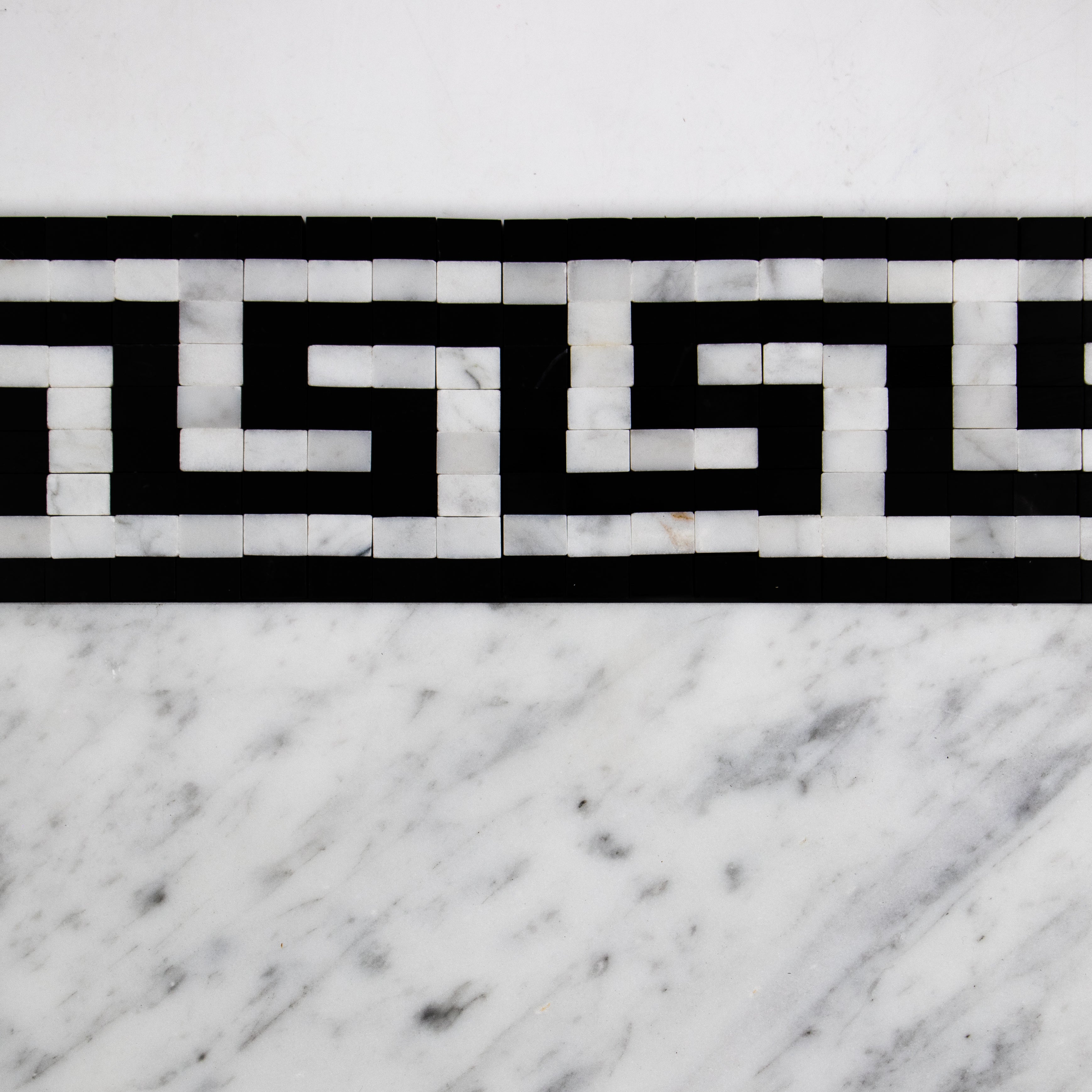 Carrara White Greek Key with Black Tiles.