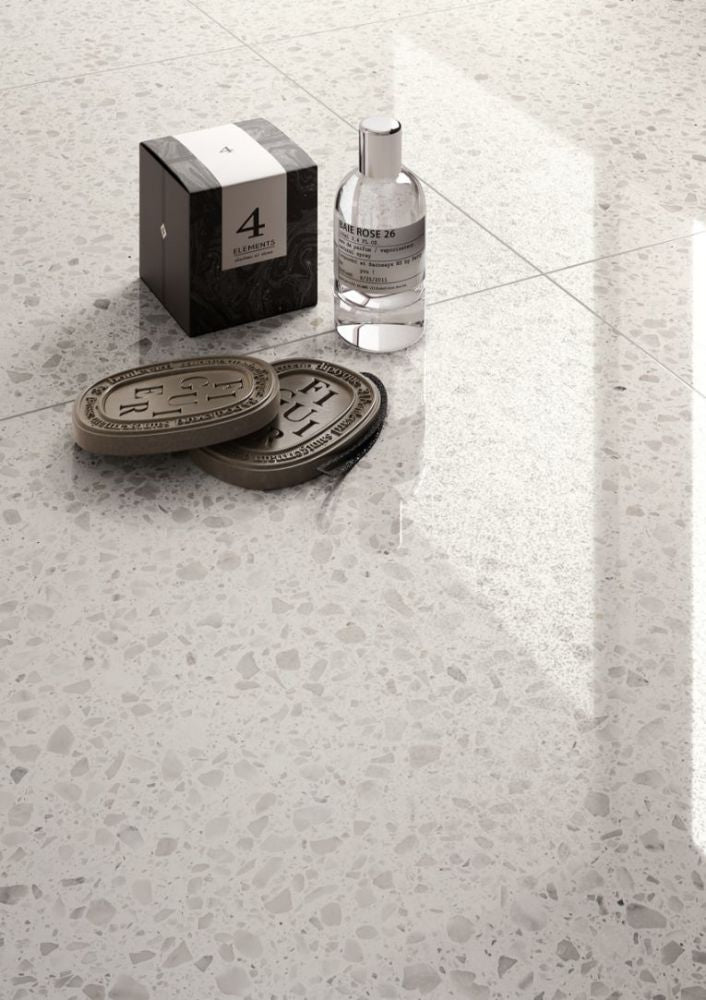 Glossy terrazzo flooring with decorative objects.