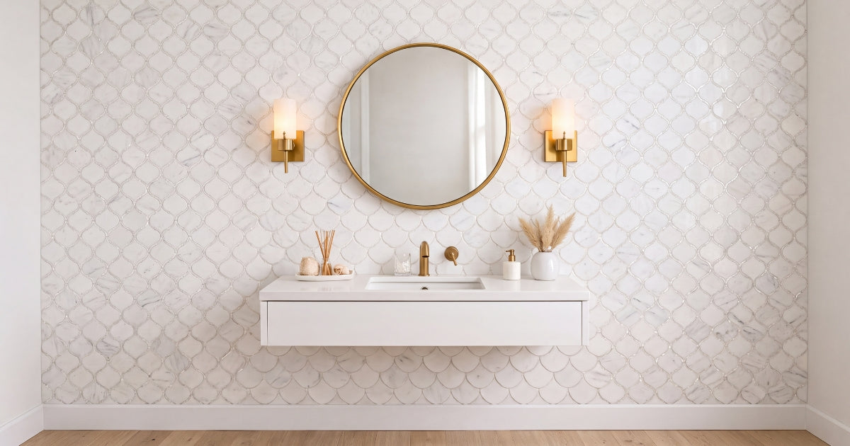White mosaic bathroom wall idea: Alice Pearl Snow White arabesque marble mosaic with mother-of-pearl detail behind a vanity