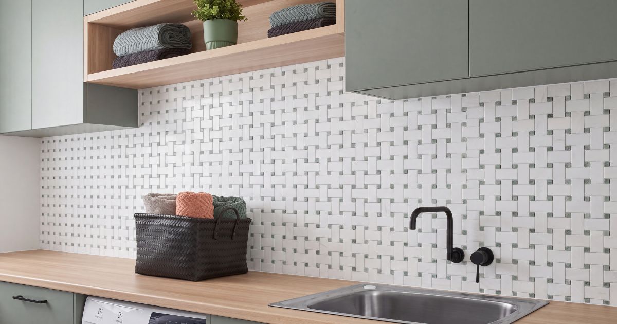 Laundry room tile idea: Thassos White Marble Basketweave with Ming Green Mosaic - basketweave pattern design in a styled laundry room