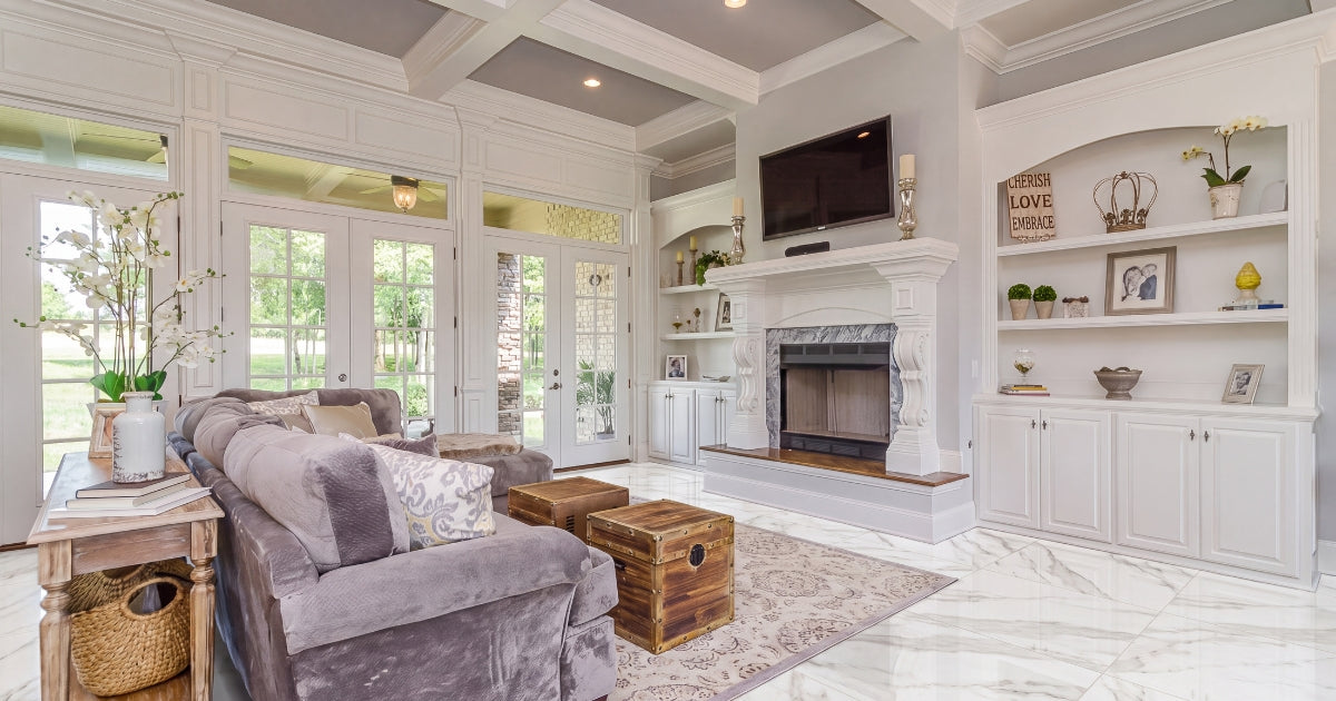 Living room tile idea: Bianchi Calacatta Luc 32 x 32 - large format calacatta marble look in a styled living room