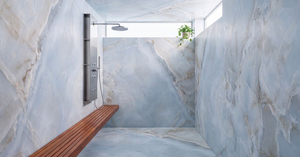 Shower tile idea: Reves Bleu Matte 12 x 24 - blue alabaster look shower tile trends in a styled shower