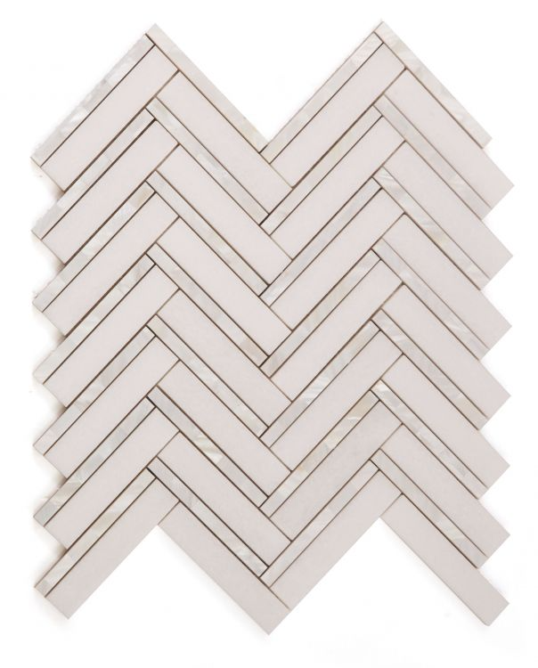 Diana Herringbone Thassos tile with white marble and pearl accents.