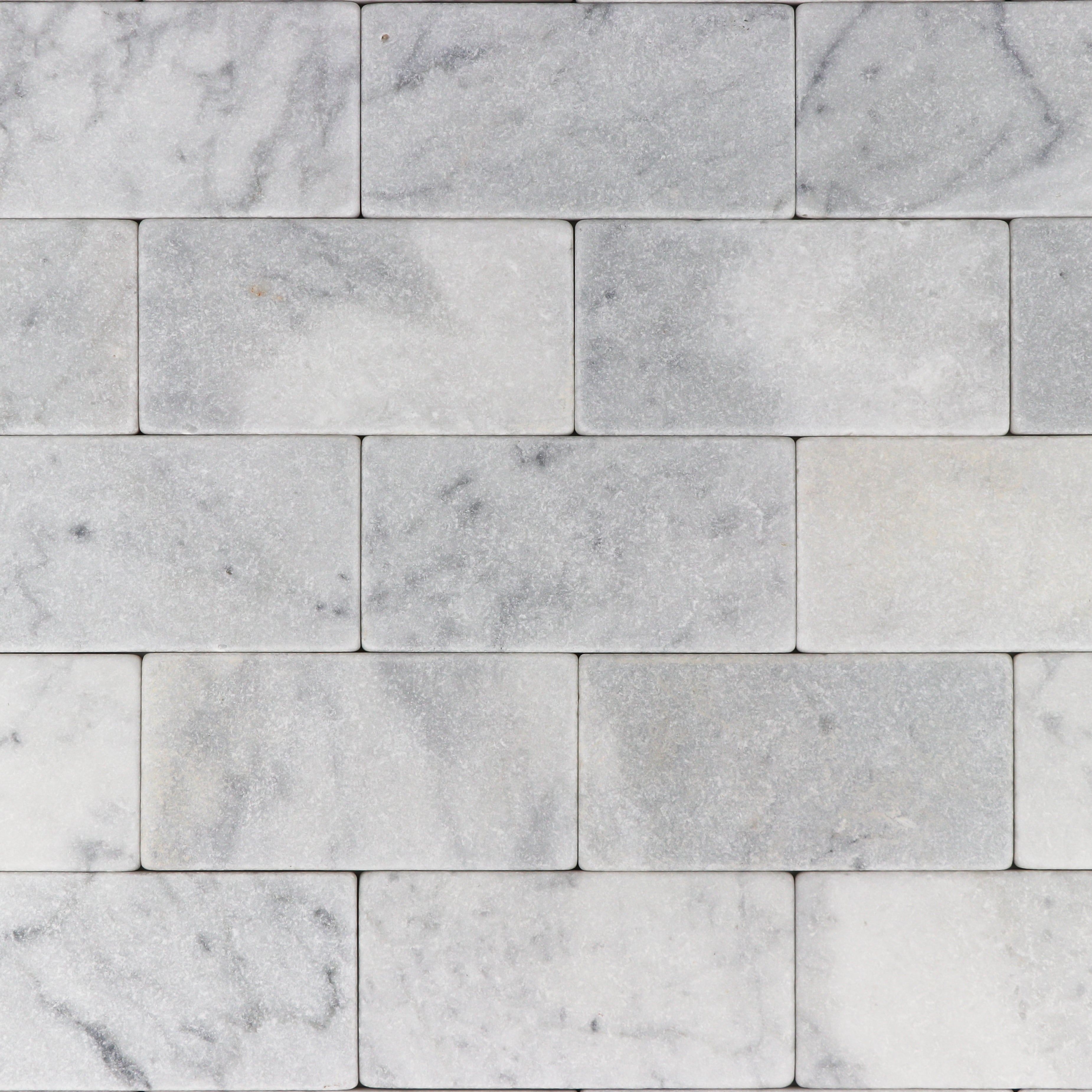 Carrara White Tumbled Tile.